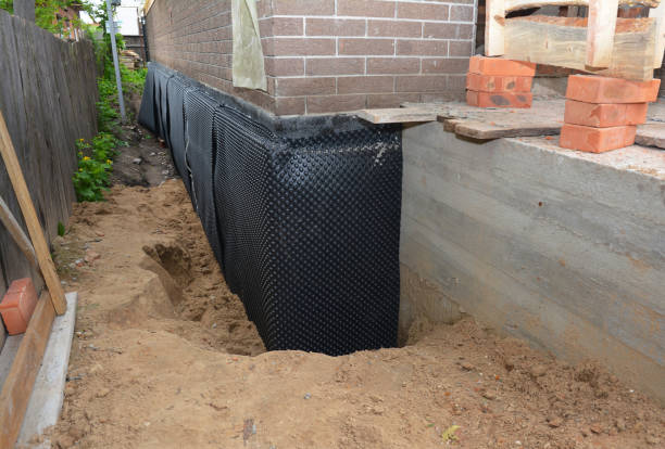 SJ Waterproofing Pros technician performing targeted Exterior Waterproofing assessment in La Grange, KY